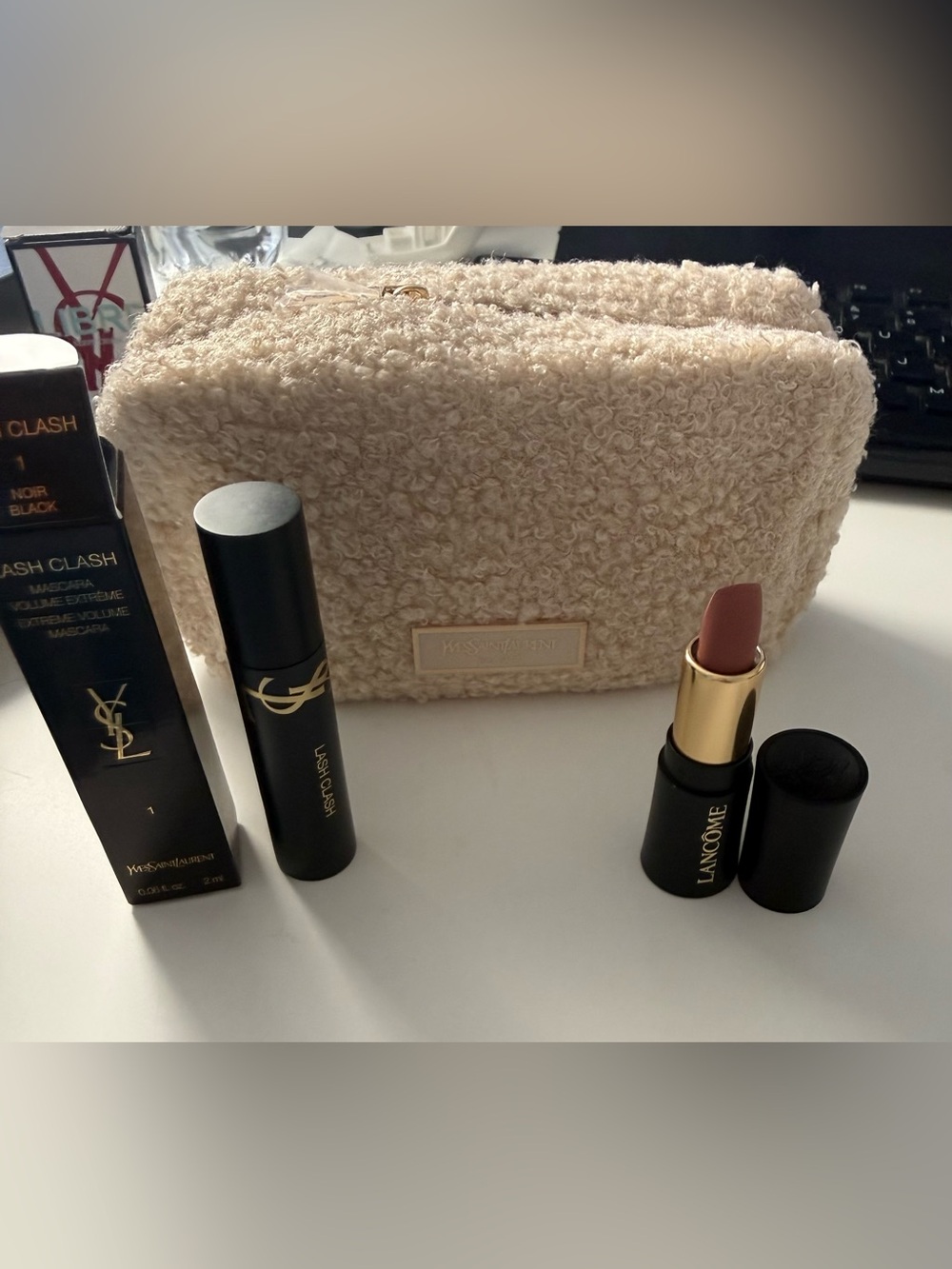 YSL cream textured cosmetic bag and YSL mascara and Lancome  nude pink lipstick